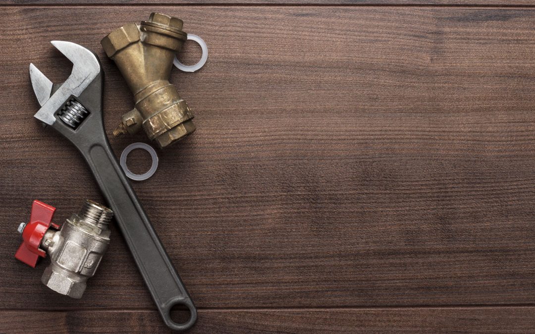 adjustable wrench and pipes